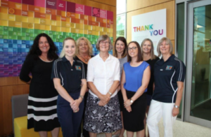 Group image shot of Carol Bower and her team
