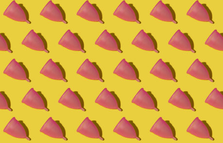 Pattern of rows of pink menstrual cups
