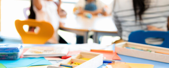 Close up of art supplies on table in kindergarten classroom