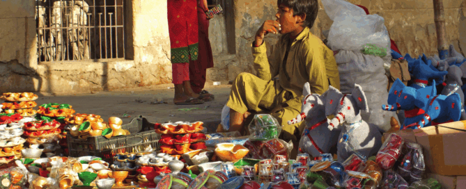 Street child selling cups